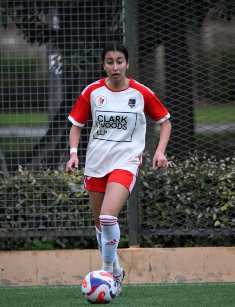 Player of Venus FC team sticking the football on Spain Tournament Trip sponsored by Clark Wood LLP 
