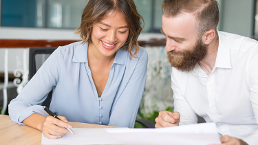 first-time-home-buyer First-time home buyers review GST rebate paperwork with Clark Woods LLP in the Lower Mainland.