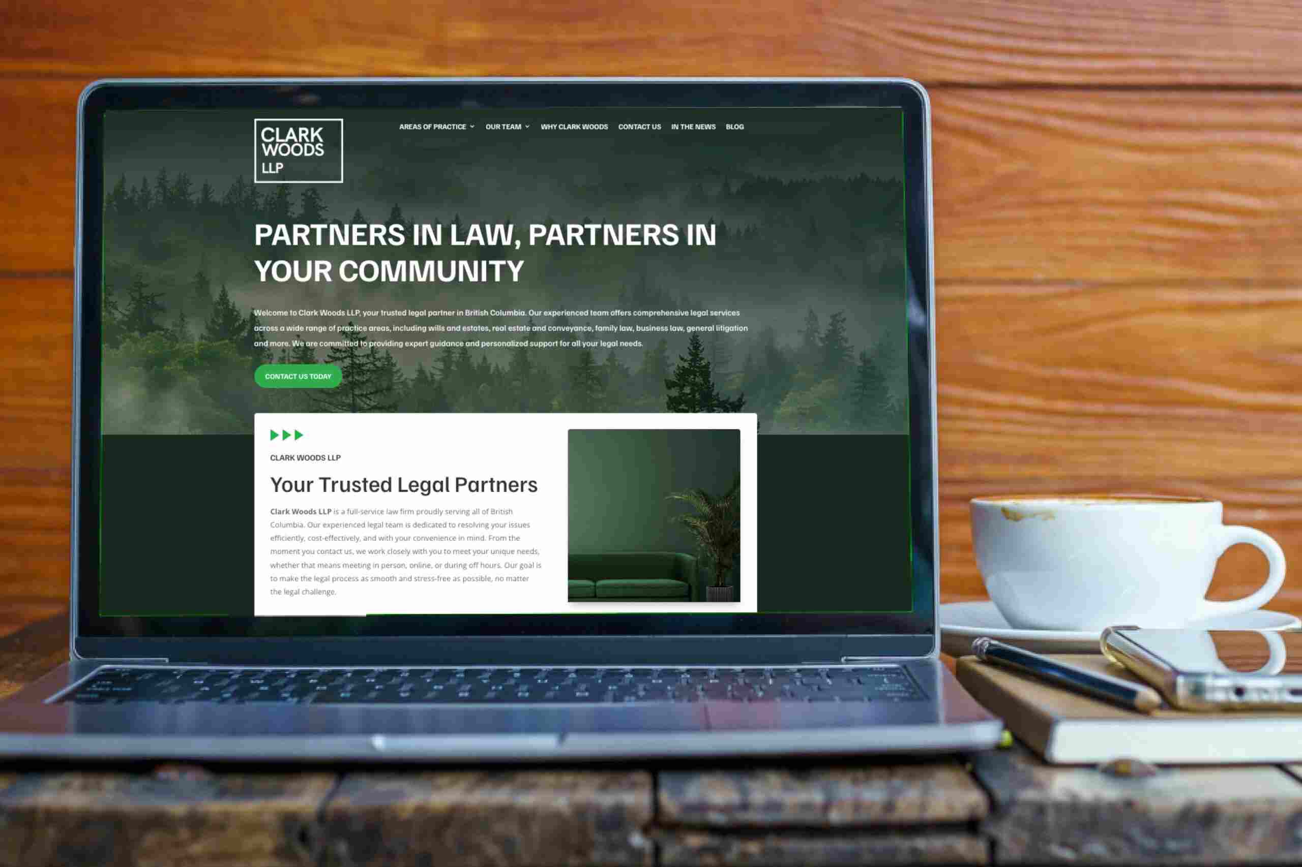 new-clark-wood-llp-website New website of Clark Woods LLP open on laptop beside a coffee cup and work diary